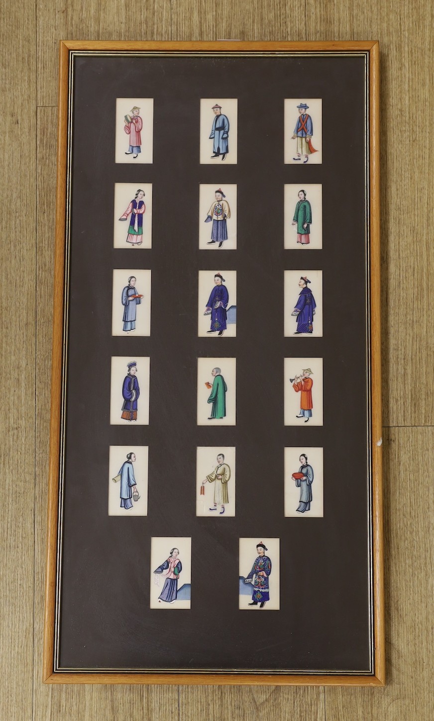 19th century Chinese School, seventeen gouaches on pith paper, Figure studies, 9 x 4.5cm, framed as one